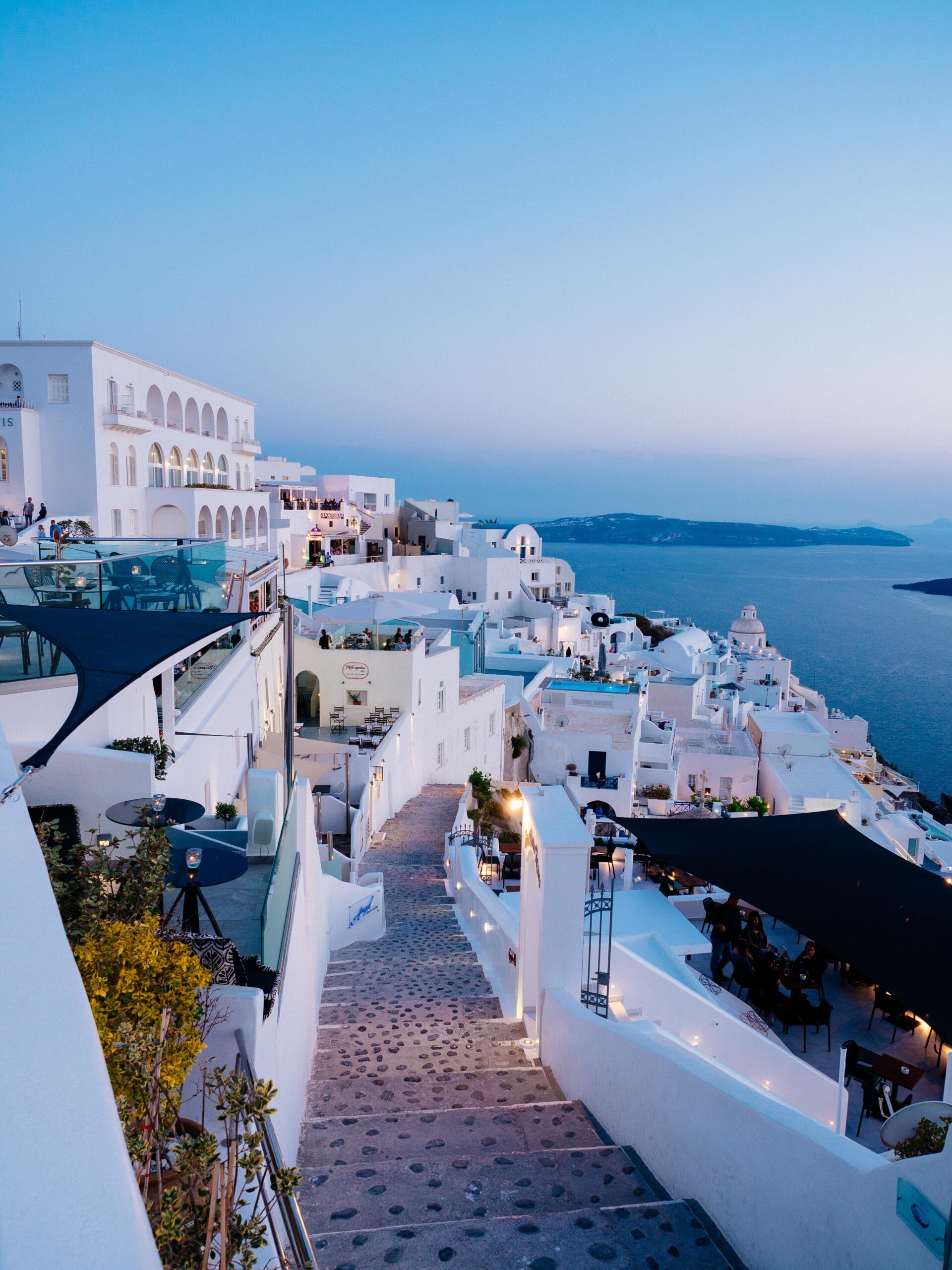 Vertical high angle shot of the white buildings in Santorini, Greece