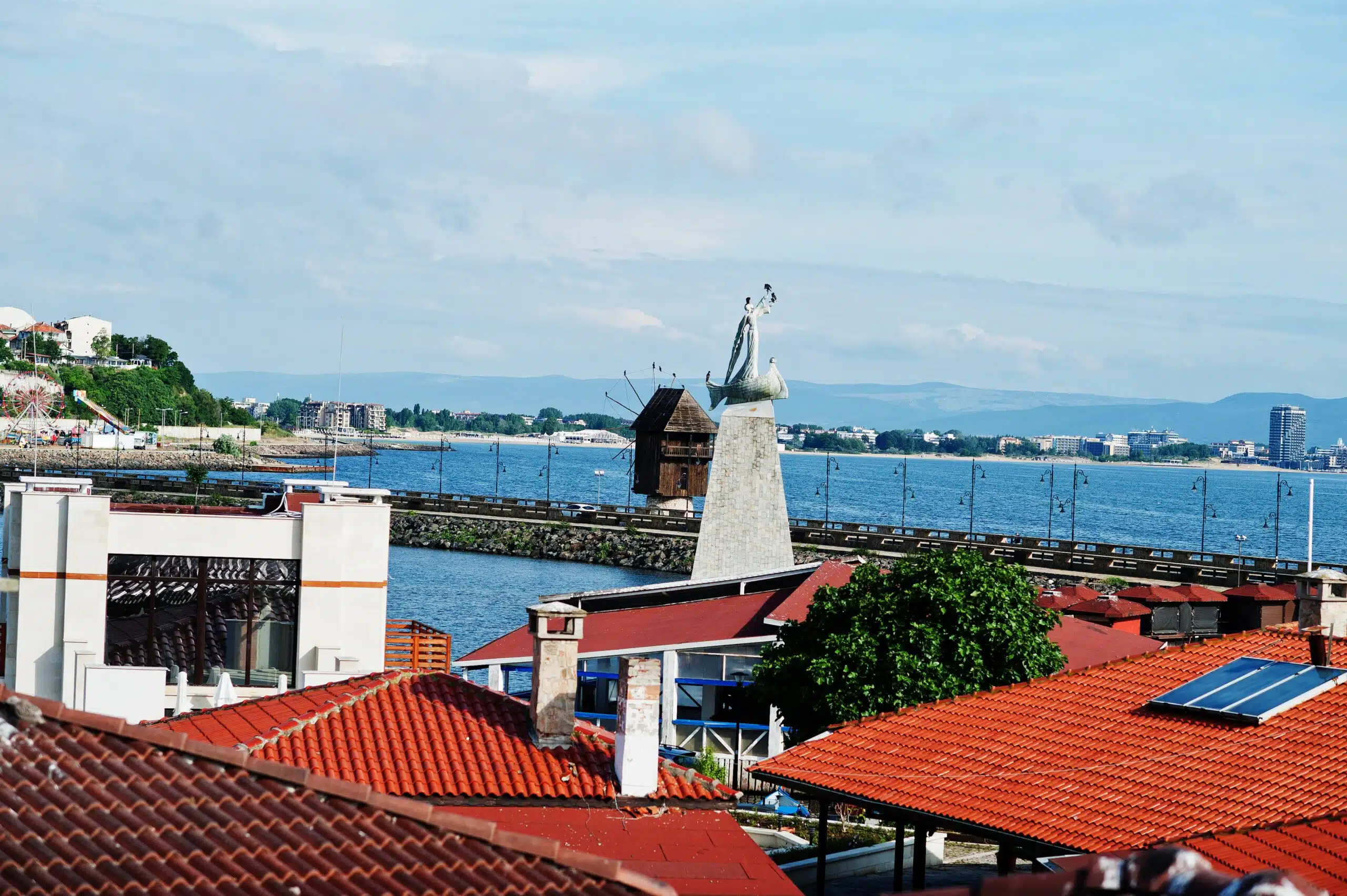 Statue of Saint Nicholas with windmill in the old town. The anci