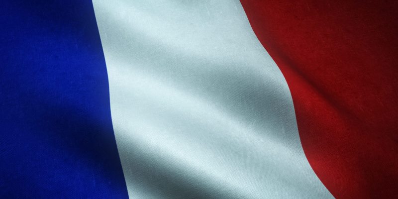 A closeup shot of the waving flag of France with interesting textures